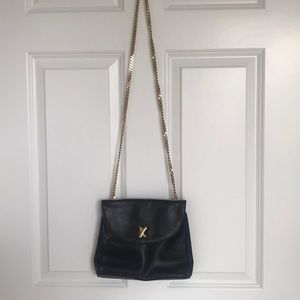 Black leather bag with gold chain